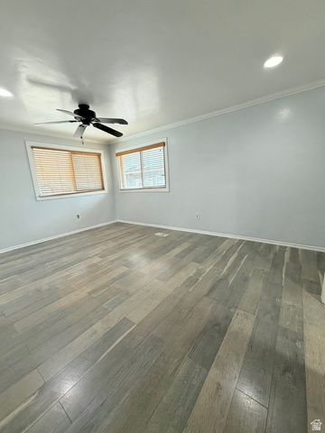 2491 Highway 89, Unit 114 Pleasant View, UT 84404 - Photo 11 of 18 Spare room with dark wood-style flooring, crown molding, ceiling fan, and recessed lighting