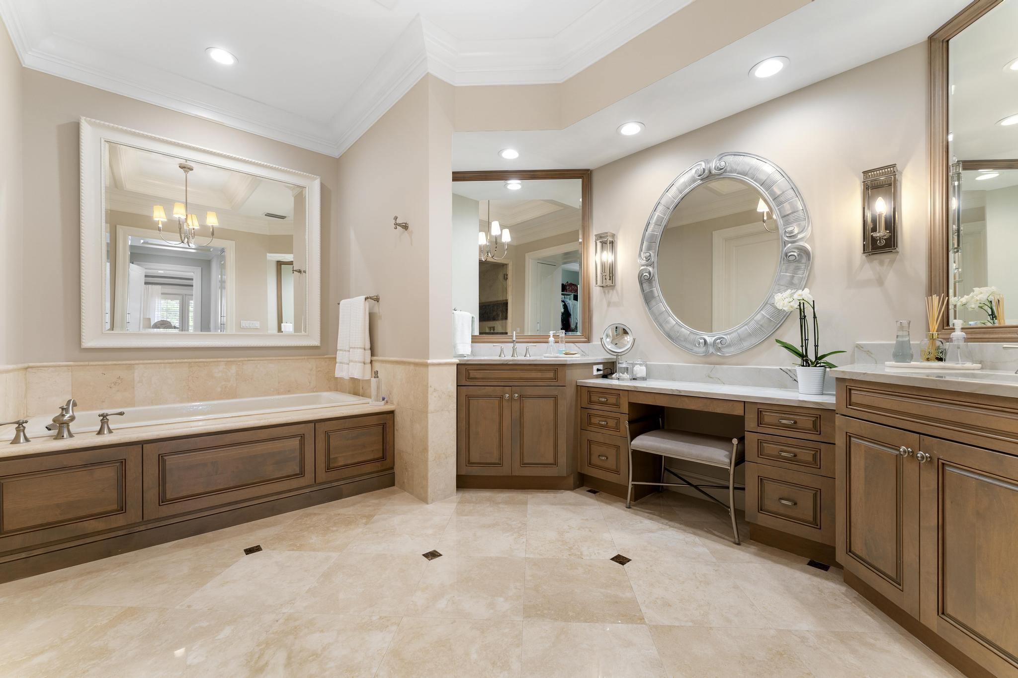 426 Red Hawk Drive Jupiter, FL 33477 - Photo 21 of 70 a spacious bathroom with a granite countertop sink mirror and bathtub