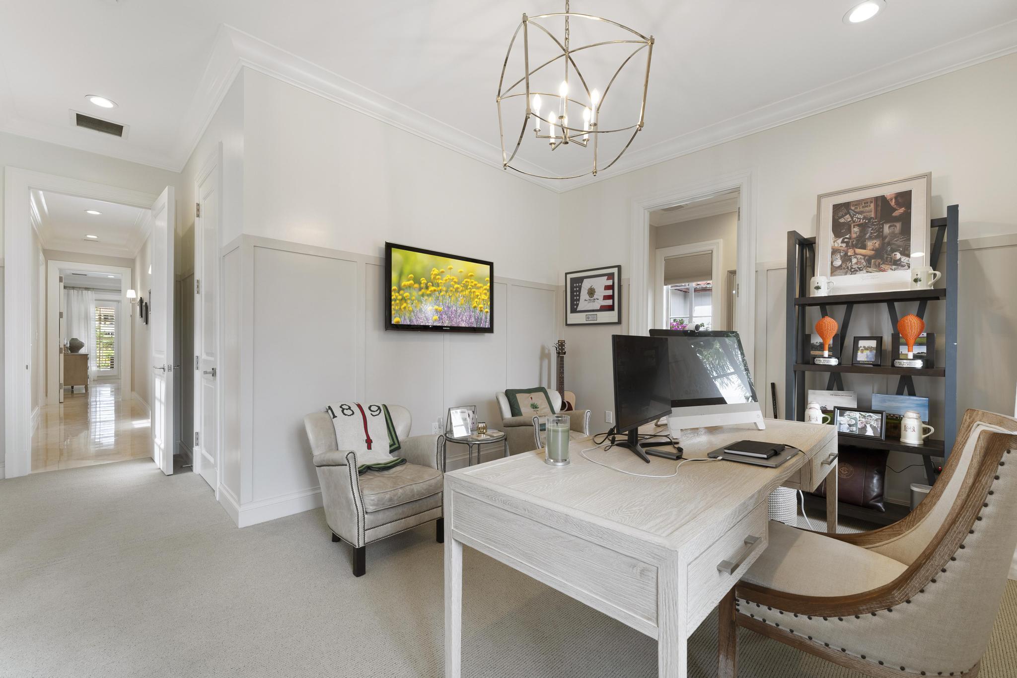 426 Red Hawk Drive Jupiter, FL 33477 - Photo 24 of 70 a living room with furniture and a flat screen tv