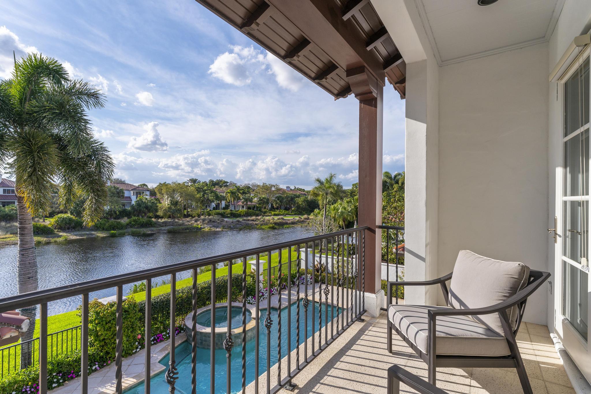 426 Red Hawk Drive Jupiter, FL 33477 - Photo 28 of 70 a view of a balcony with lake view and wooden floor