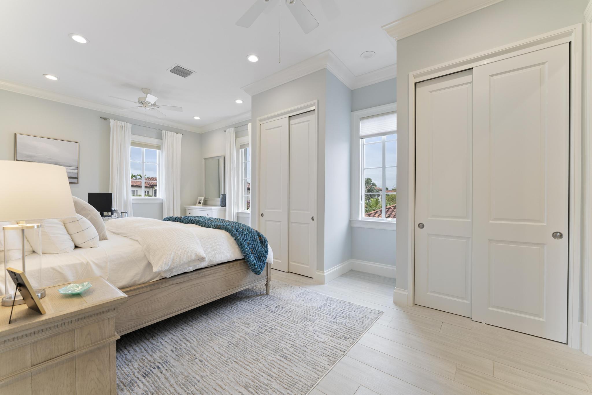 426 Red Hawk Drive Jupiter, FL 33477 - Photo 31 of 70 a large bedroom with bed and large window