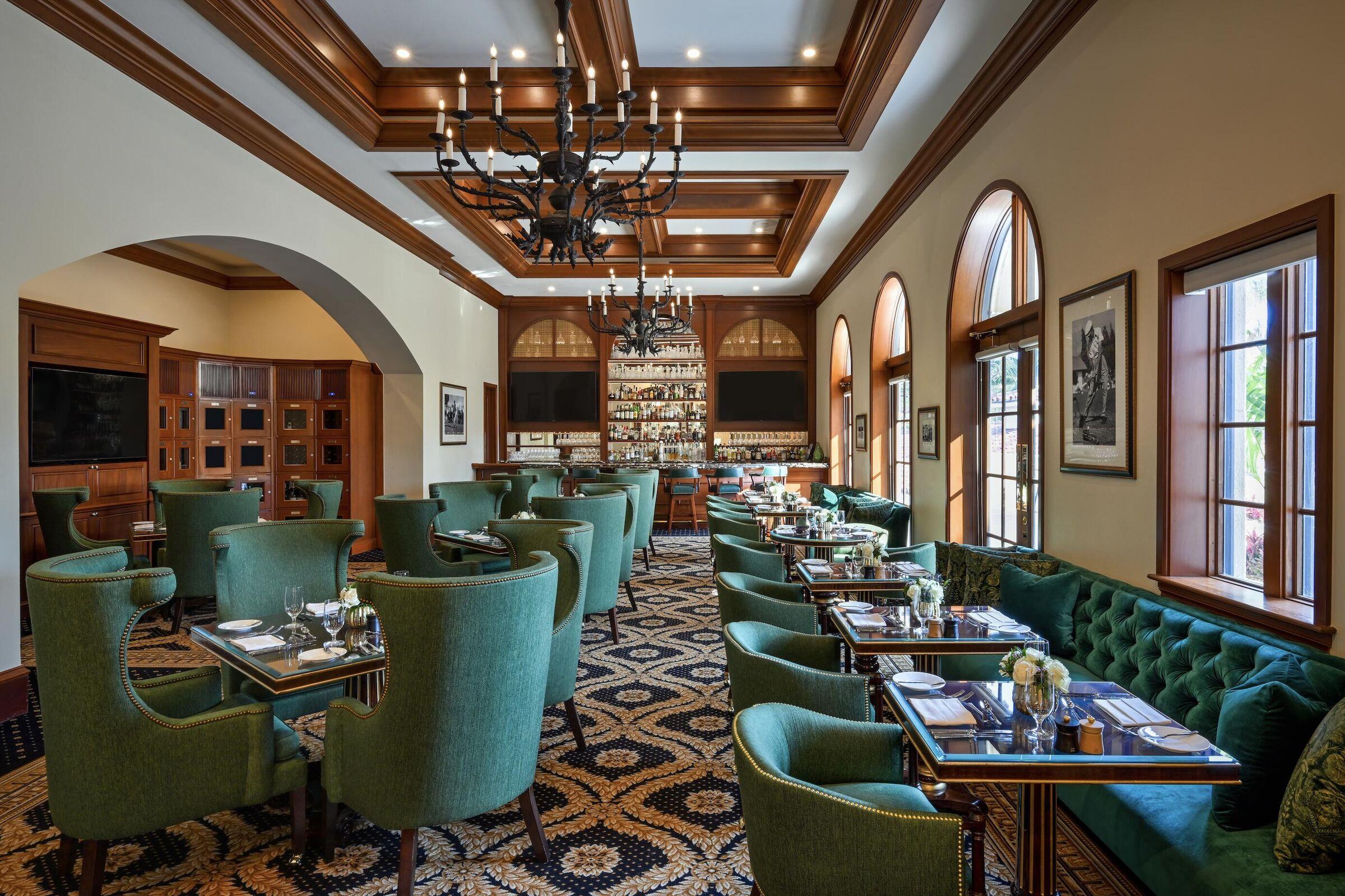 426 Red Hawk Drive Jupiter, FL 33477 - Photo 62 of 70 a view of a dining room with furniture a chandelier and wooden floor