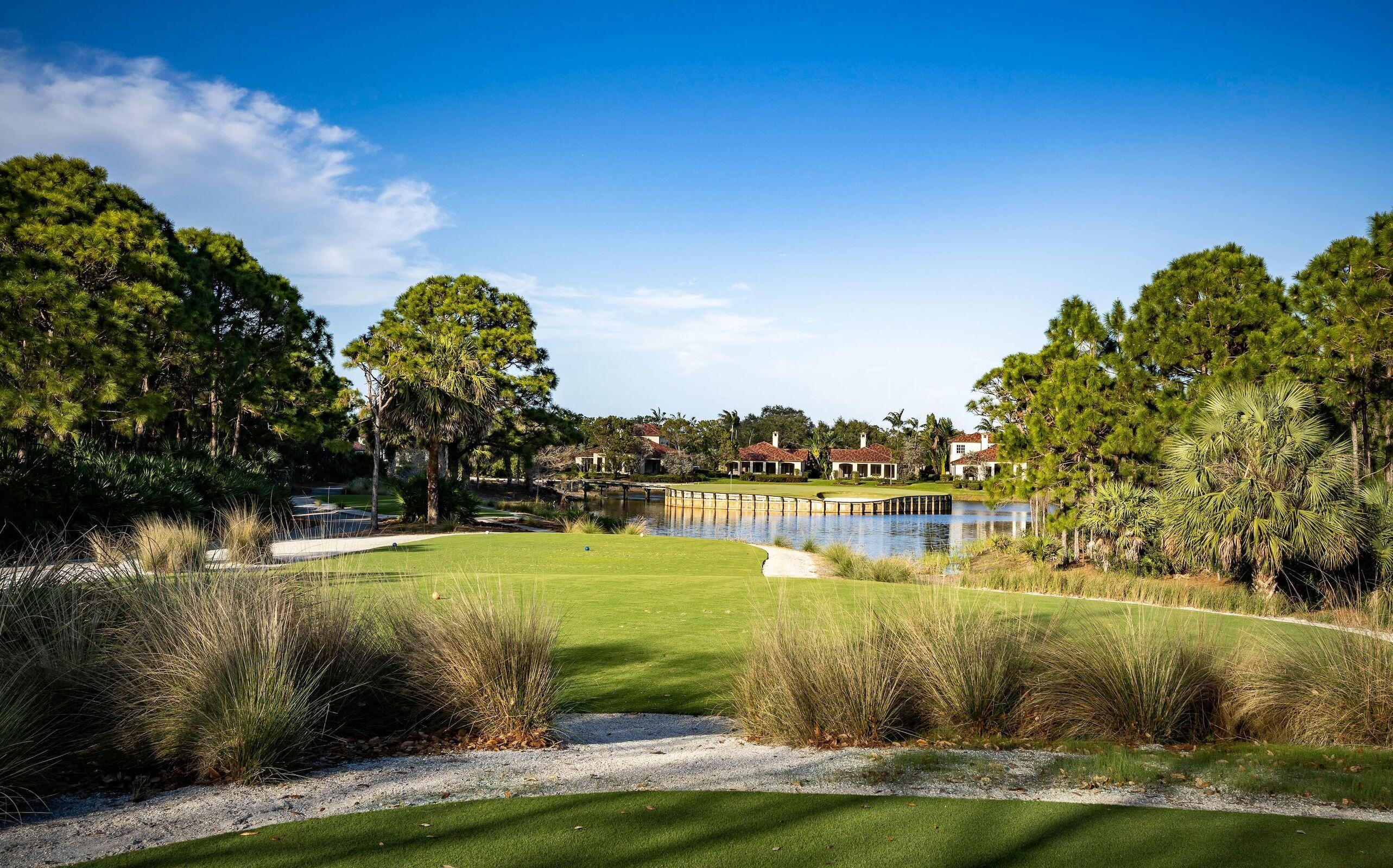 426 Red Hawk Drive Jupiter, FL 33477 - Photo 68 of 70 a view of a lake with a big yard