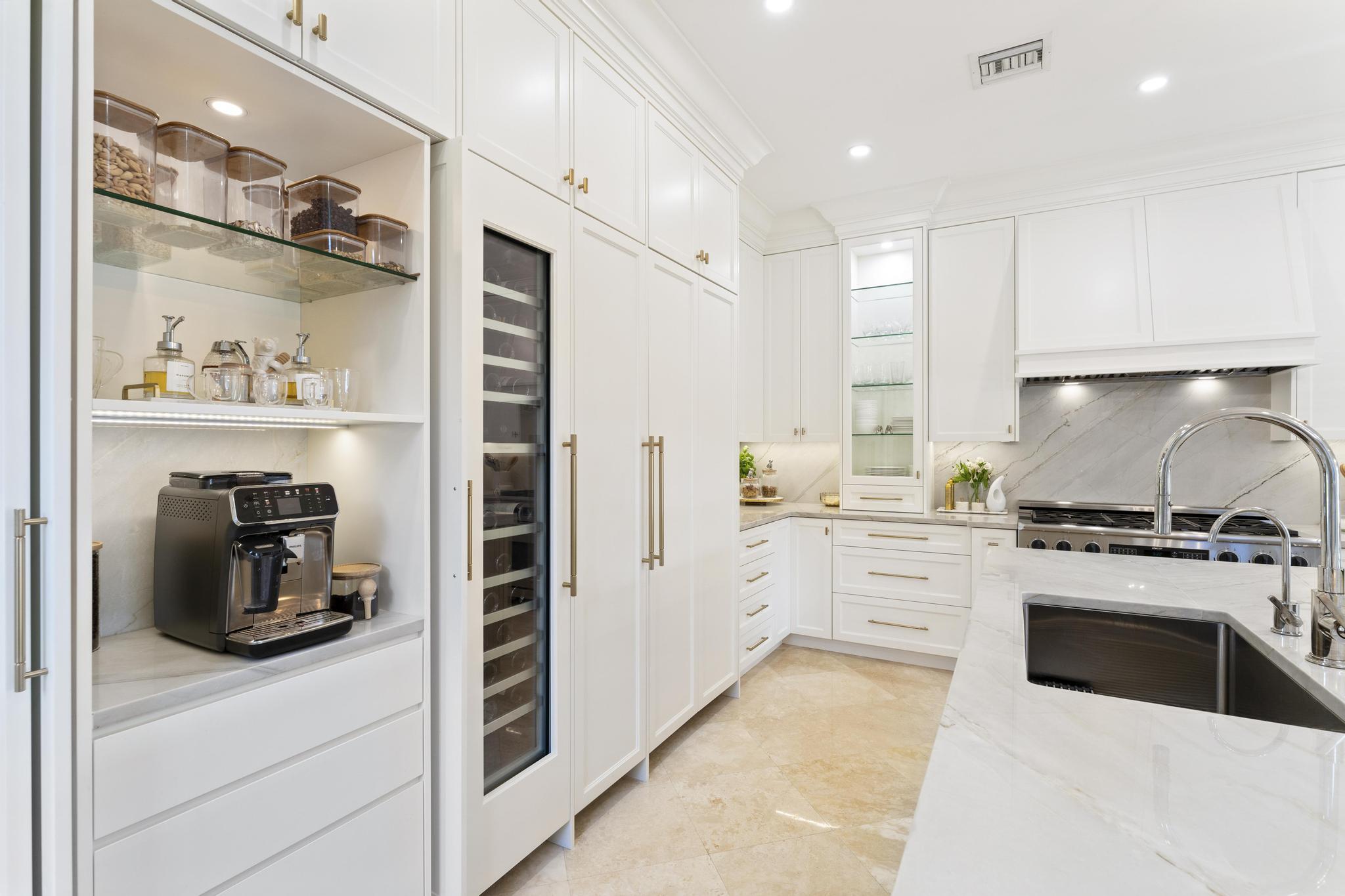 426 Red Hawk Drive Jupiter, FL 33477 - Photo 10 of 70 a kitchen with a refrigerator and white cabinets