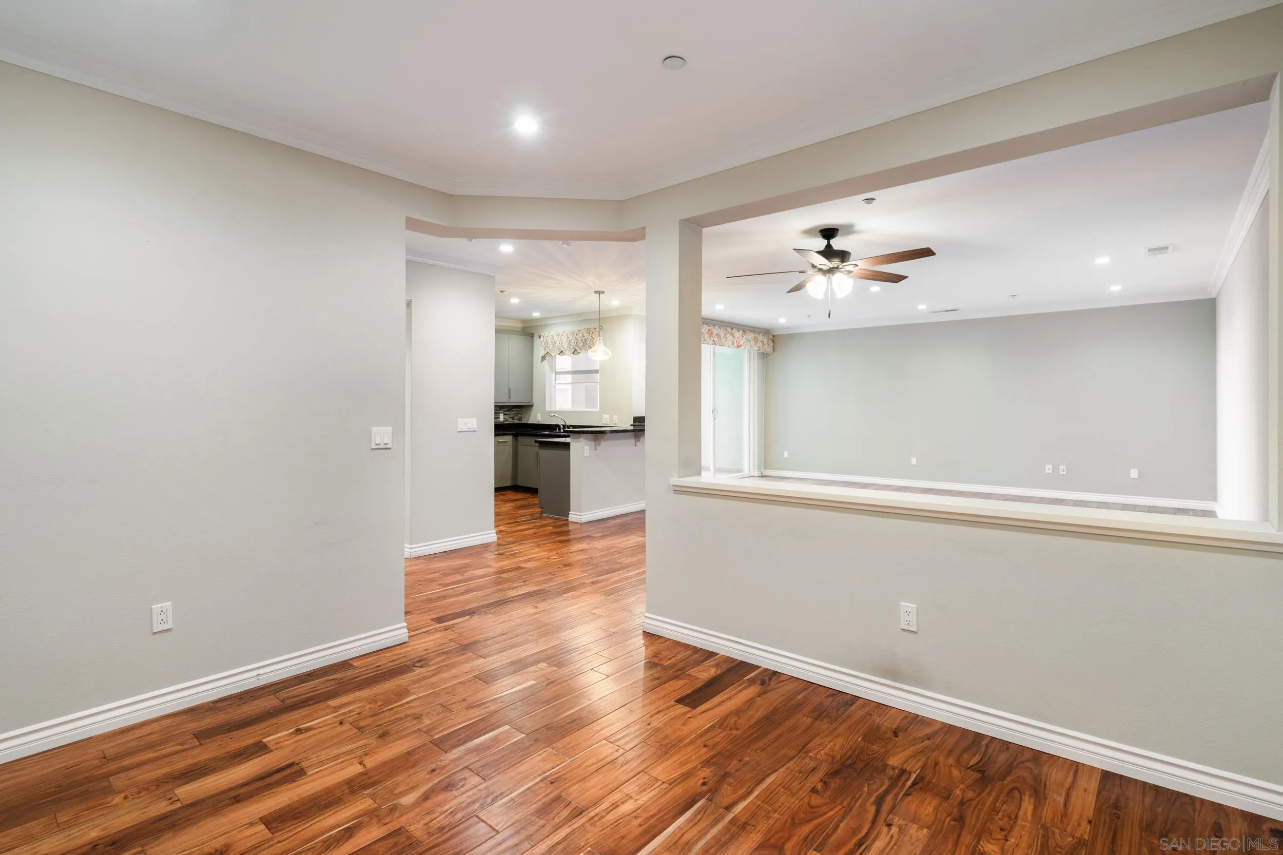 3650 Fifth Avenue, Unit 415 San Diego, CA 92103 - Photo 12 of 31 wooden floor in an empty room with a window