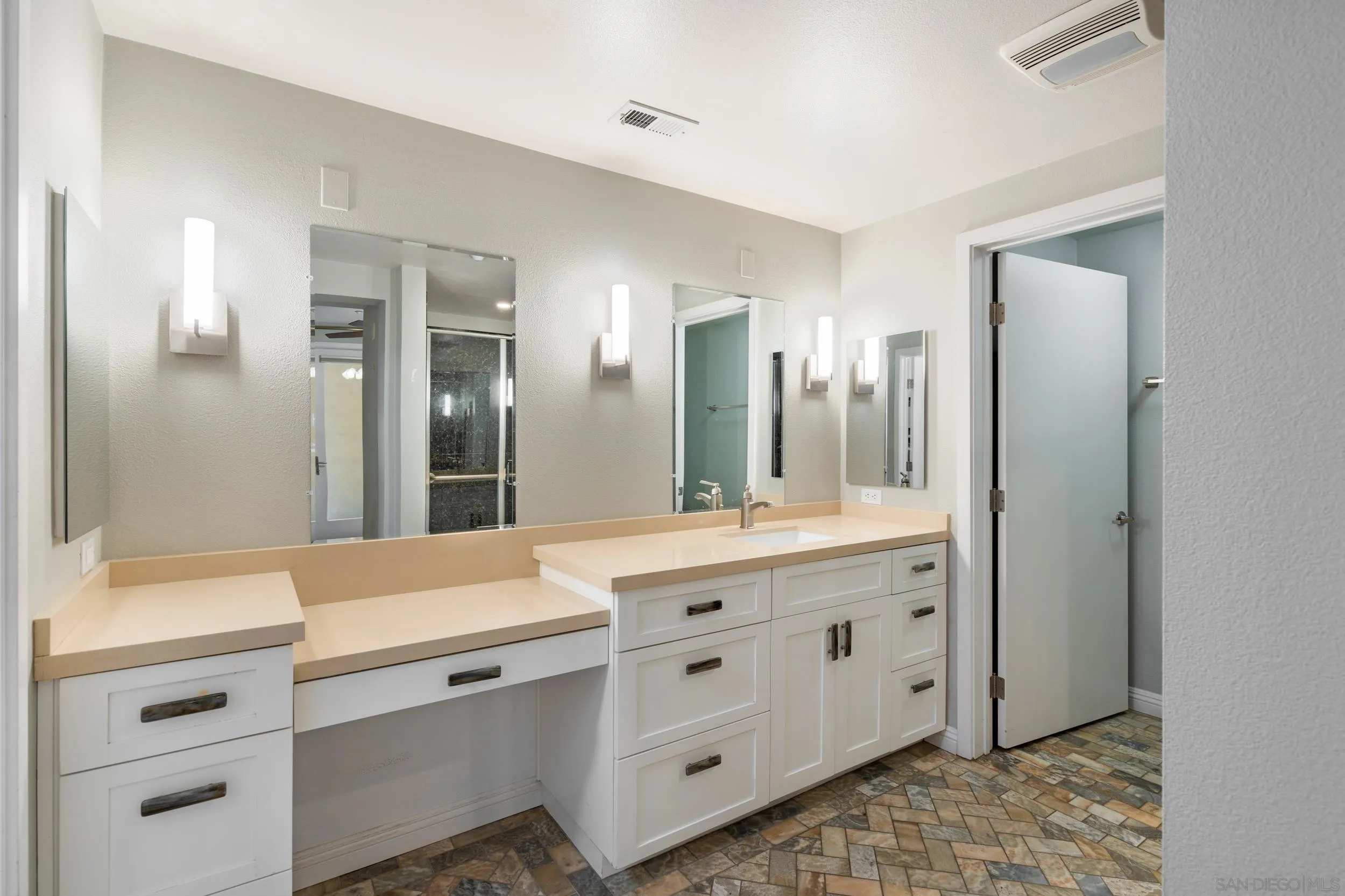3650 Fifth Avenue, Unit 415 San Diego, CA 92103 - Photo 15 of 31 a bathroom with a double vanity sink and mirror with shower