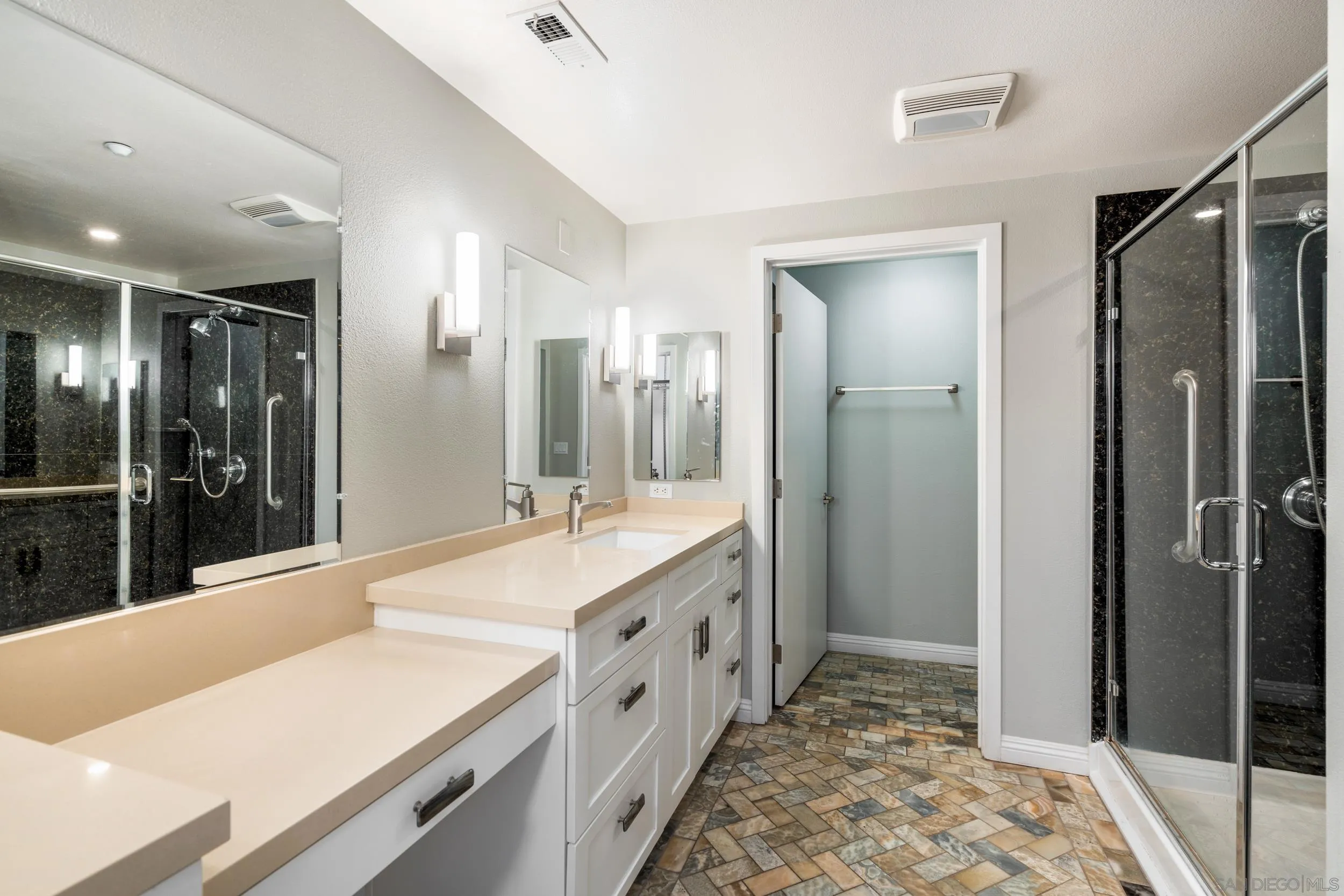 3650 Fifth Avenue, Unit 415 San Diego, CA 92103 - Photo 16 of 31 a bathroom with a tub sink and shower