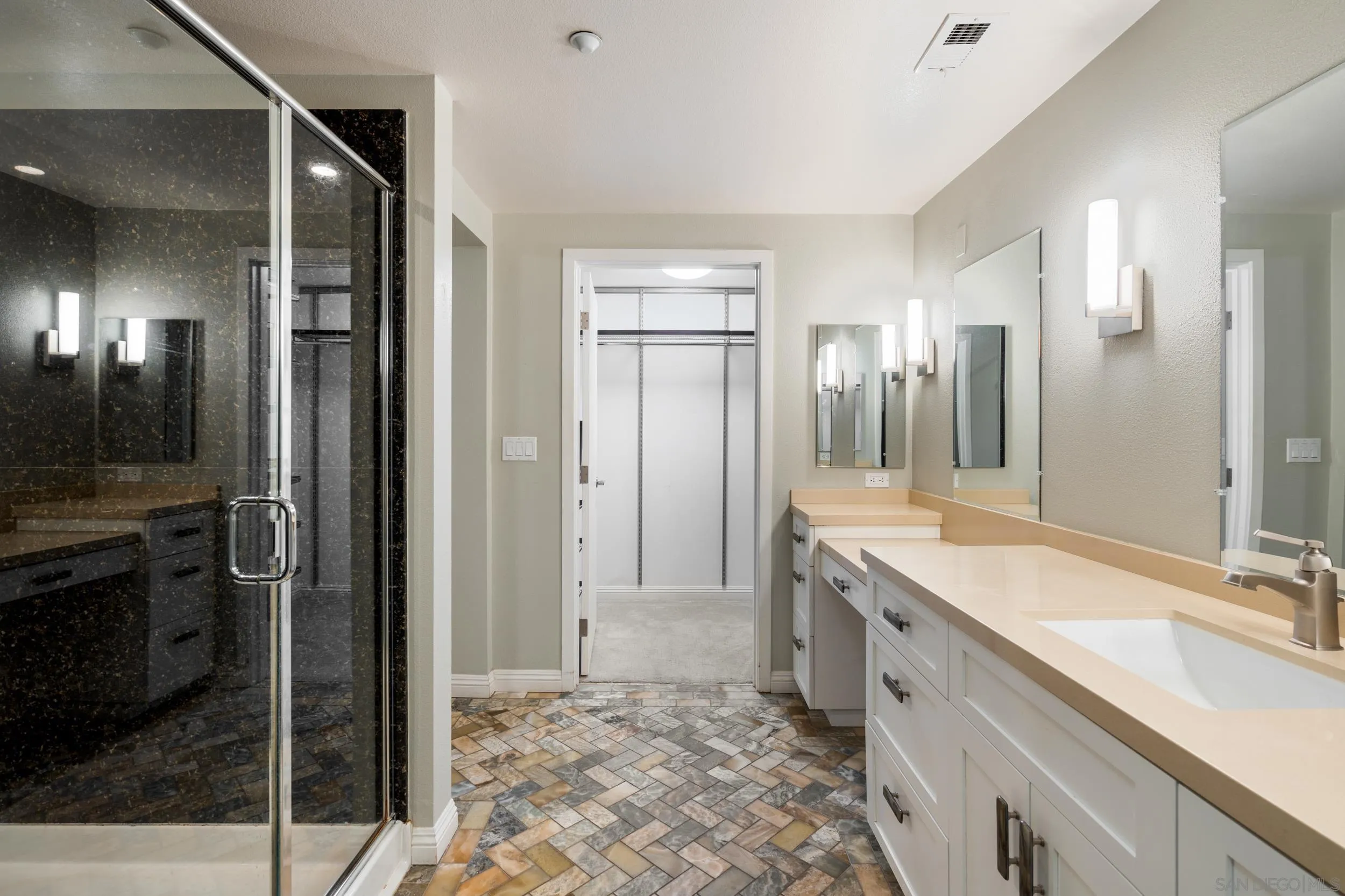 3650 Fifth Avenue, Unit 415 San Diego, CA 92103 - Photo 17 of 31 a bathroom with a double vanity sink and a mirror