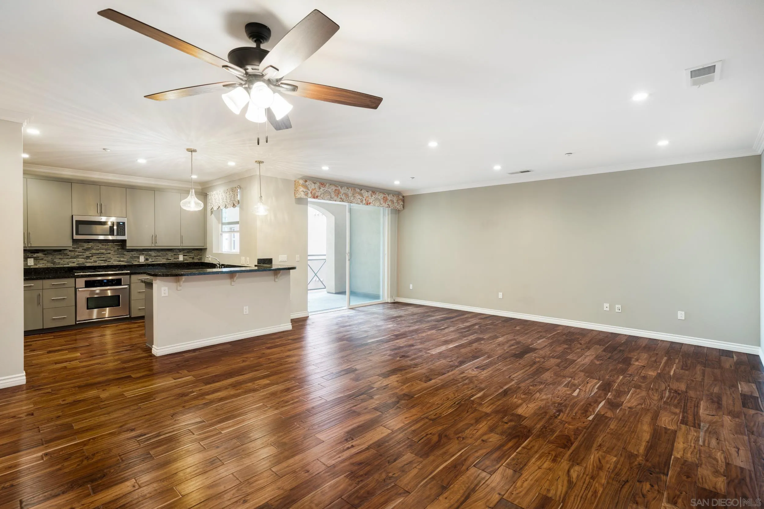3650 Fifth Avenue, Unit 415 San Diego, CA 92103 - Photo 5 of 31 a view of kitchen with granite countertop stainless steel appliances and wooden floor