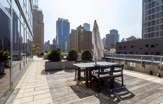 a view of a terrace with furniture