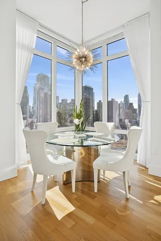 a large kitchen with stainless steel appliances granite countertop a sink and cabinets