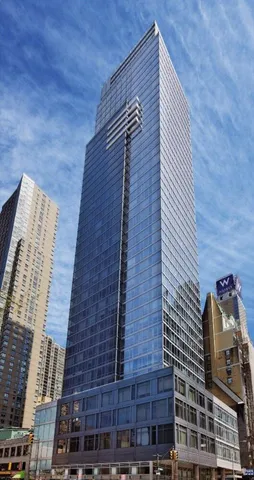 a bathroom with a toilet a sink and a mirror