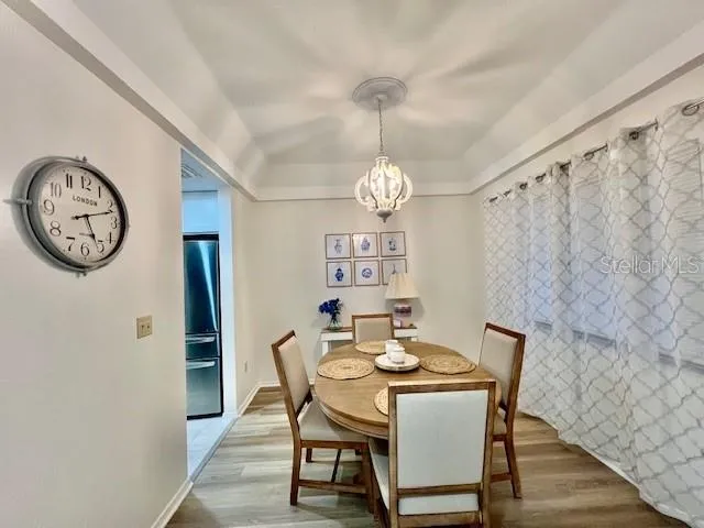 a kitchen with stainless steel appliances kitchen island granite countertop a sink and cabinets