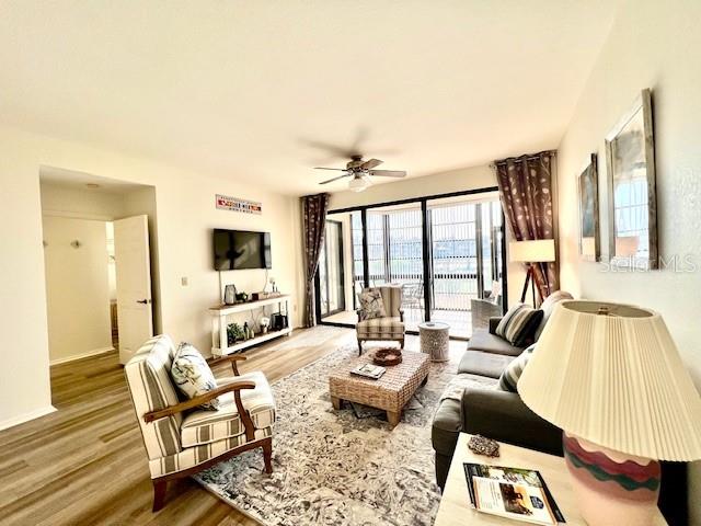 3020 Matecumbe Key Road, Unit 103 Punta Gorda, FL 33955 - Photo 20 of 55 a living room with furniture and a flat screen tv
