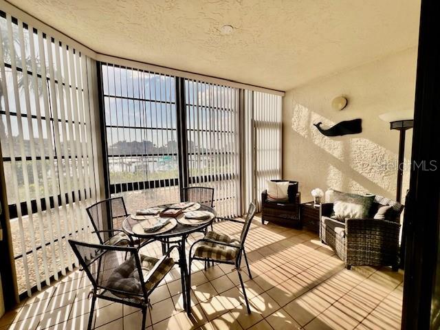 3020 Matecumbe Key Road, Unit 103 Punta Gorda, FL 33955 - Photo 21 of 55 a view of a dining room with furniture window and wooden floor