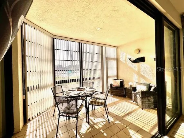 a bedroom with a large bed and a flat screen tv