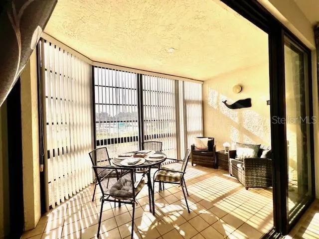 a bedroom with a large bed and a flat screen tv