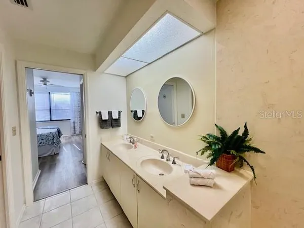 a bathroom with a shower and a sink