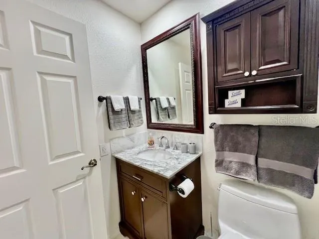 a walk in closet with a couch