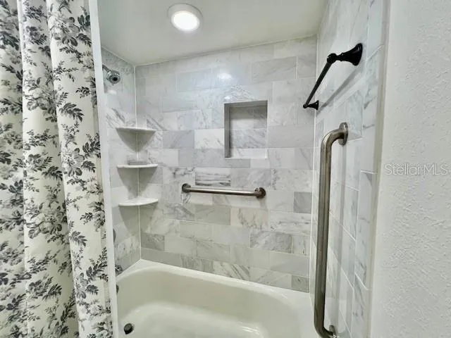 a view of outdoor space with swimming pool and lounge chair