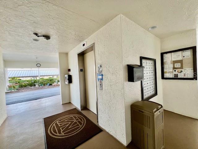 3020 Matecumbe Key Road, Unit 103 Punta Gorda, FL 33955 - Photo 35 of 55 a walk in closet with a couch