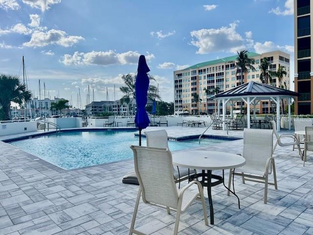 3020 Matecumbe Key Road, Unit 103 Punta Gorda, FL 33955 - Photo 7 of 55 a view of a patio with dining table and chairs