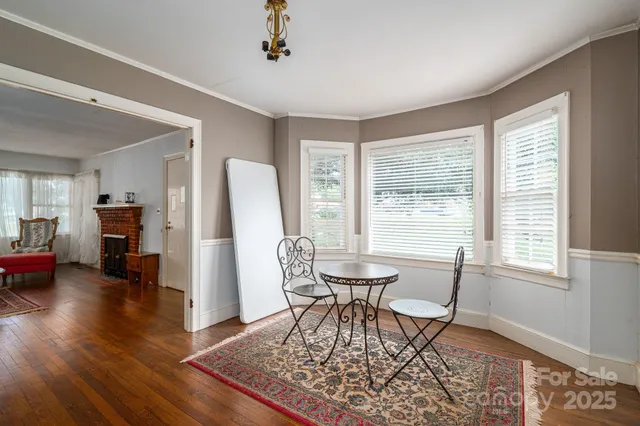 a view of a livingroom with furniture and a window