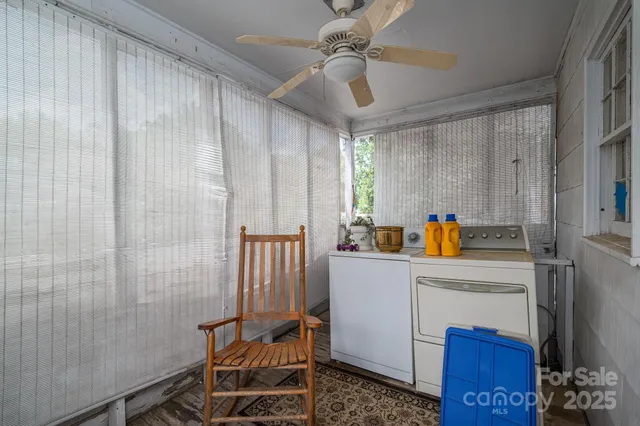 a view of storage and utility room with a window