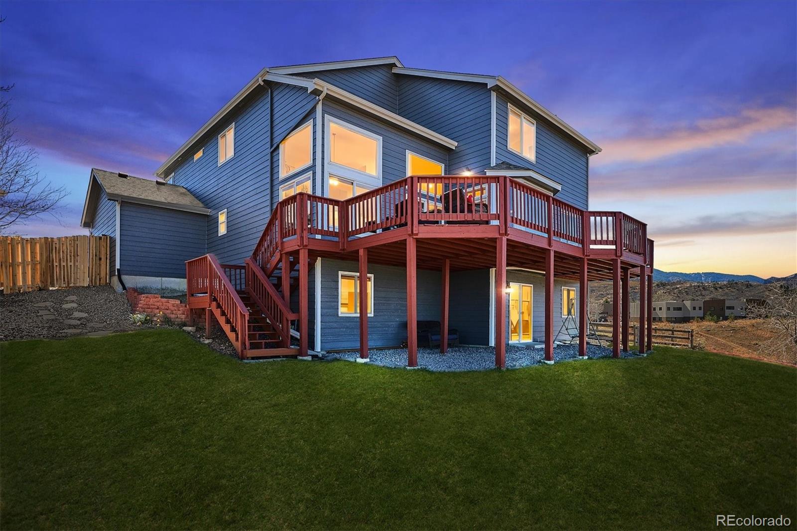 4143 South Deframe Court Morrison, CO 80465 - Photo 46 of 48 a front view of a house with a garden