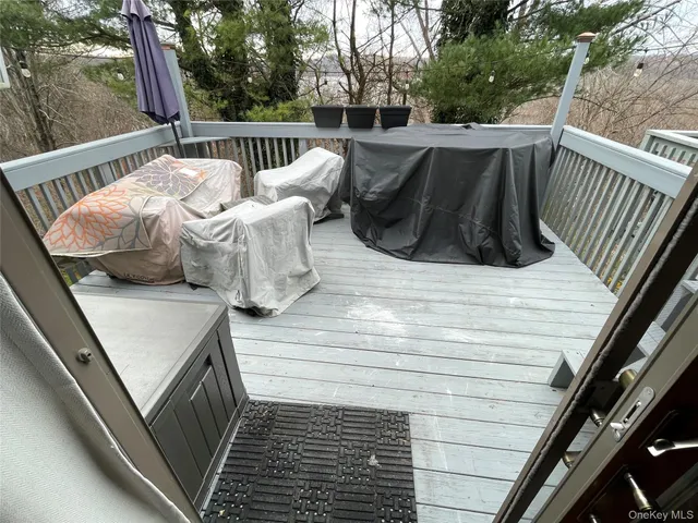 a view of balcony with furniture