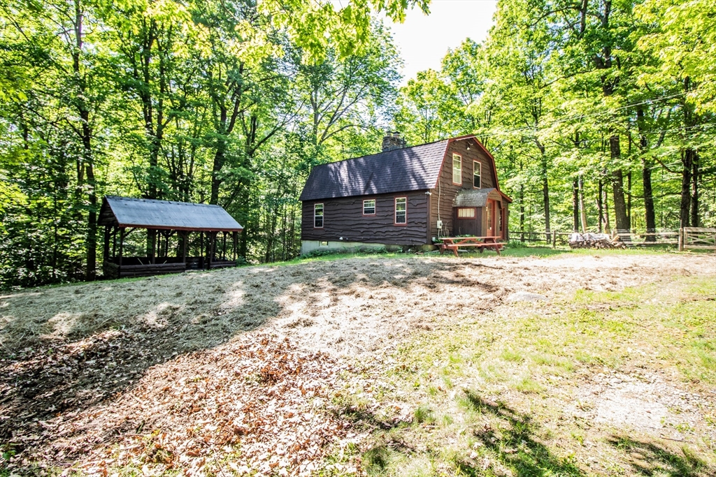 31 Flagg Hill Road Heath, MA 01346 - Photo 3 of 23 a backyard of a house with table and chairs