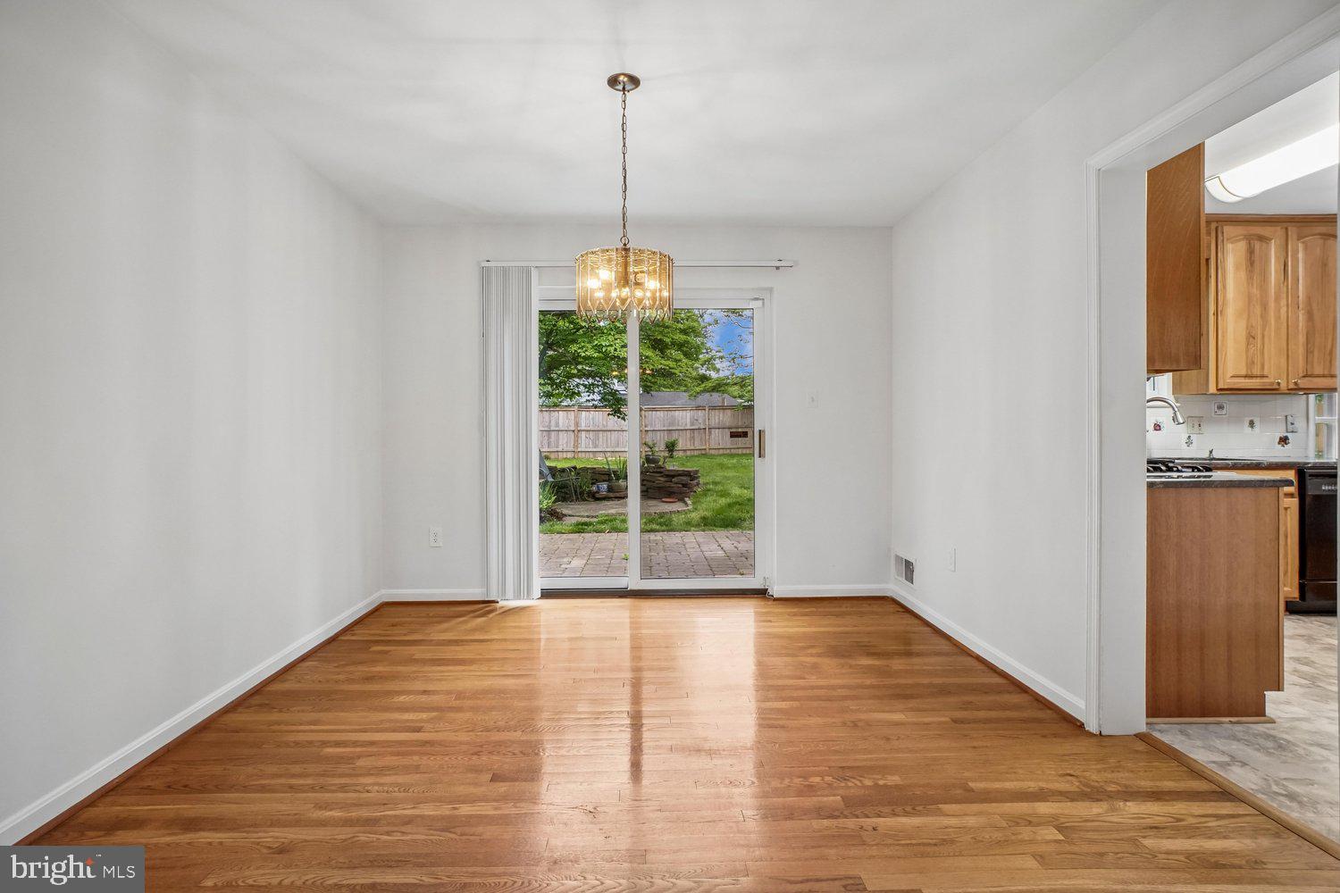 8933 Burke Lake Road Springfield, VA 22151 - Photo 15 of 47 Dining Room With Sliding Glass Door to Patio