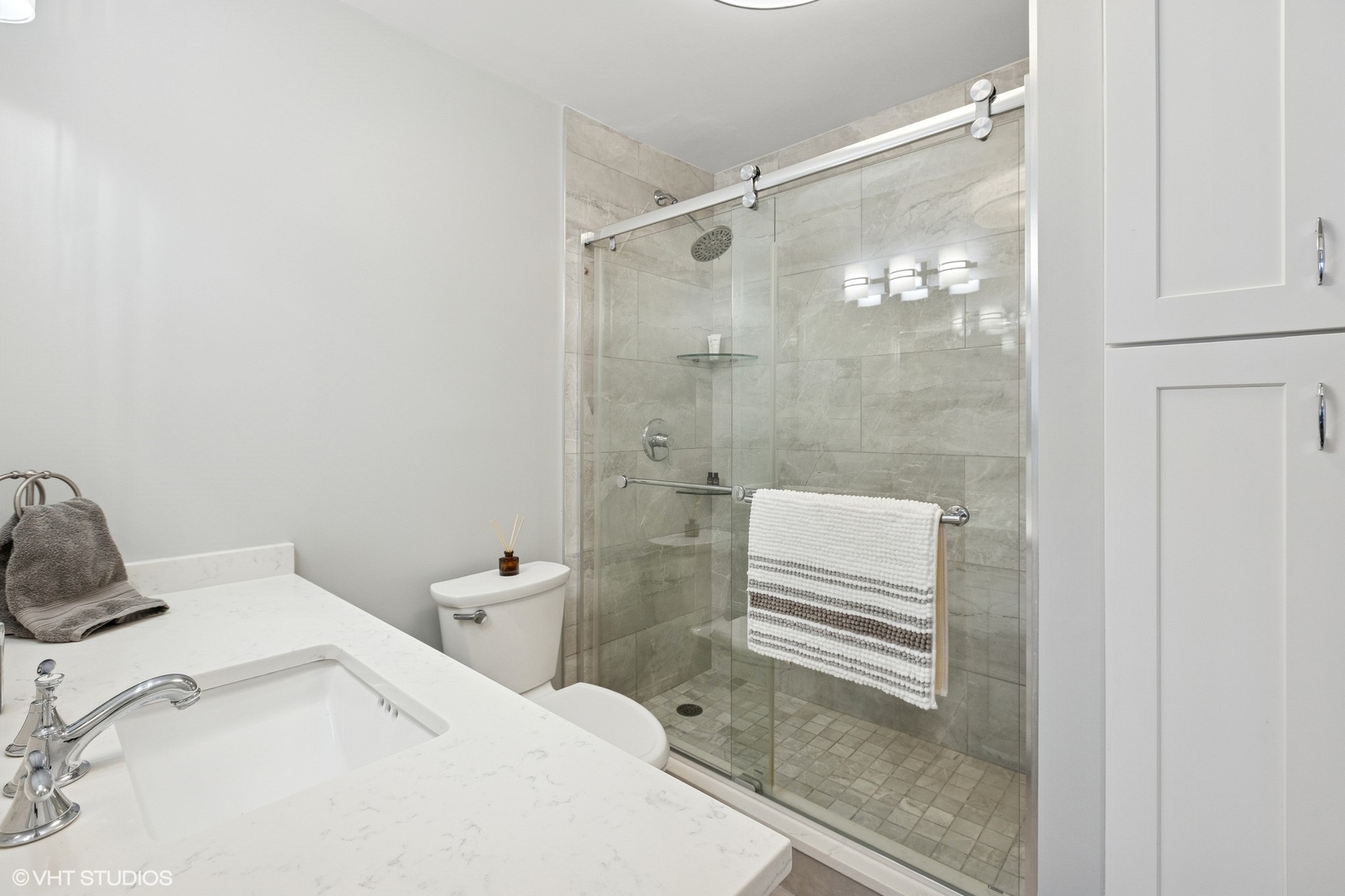 5415 North Sheridan Road, Unit 3004 Chicago, IL 60640 - Photo 12 of 26 a bathroom with a sink and a shower