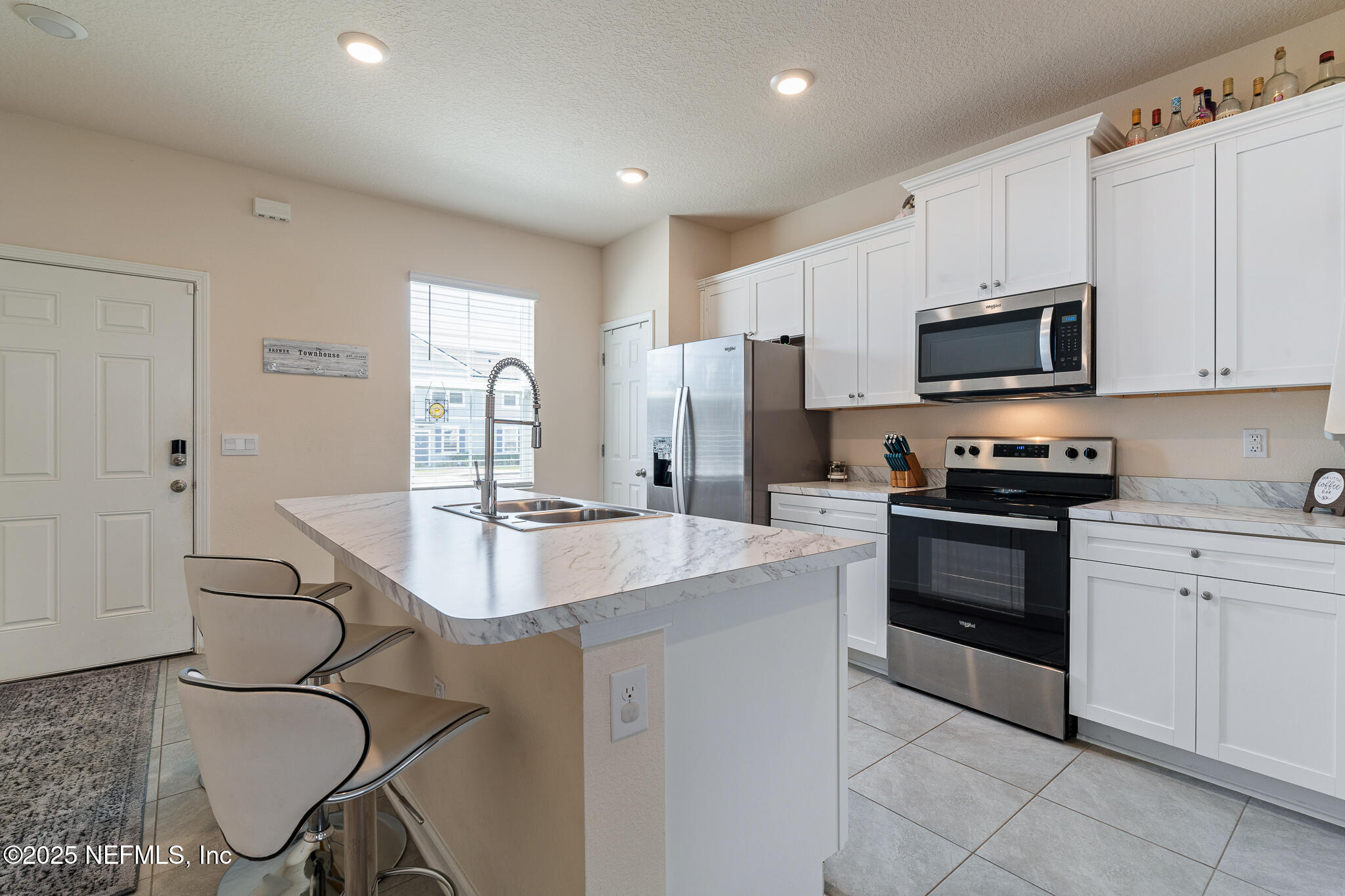 113 Red House Cir Street St. Augustine, FL 32084 - Photo 11 of 40 a kitchen with granite countertop a sink stove and refrigerator