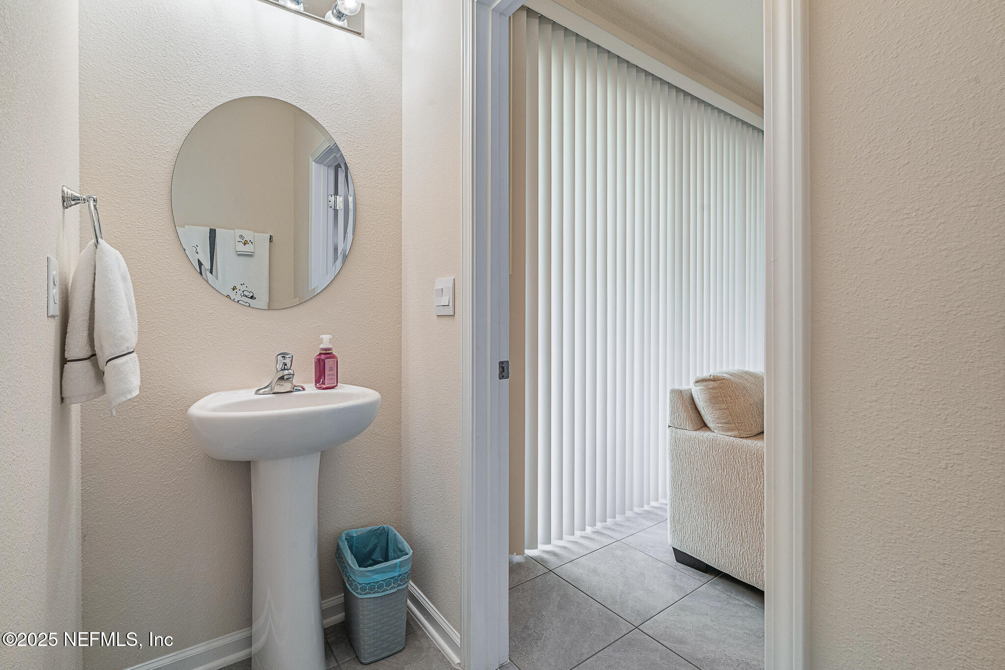 113 Red House Cir Street St. Augustine, FL 32084 - Photo 16 of 40 a bathroom with a sink a toilet and a mirror