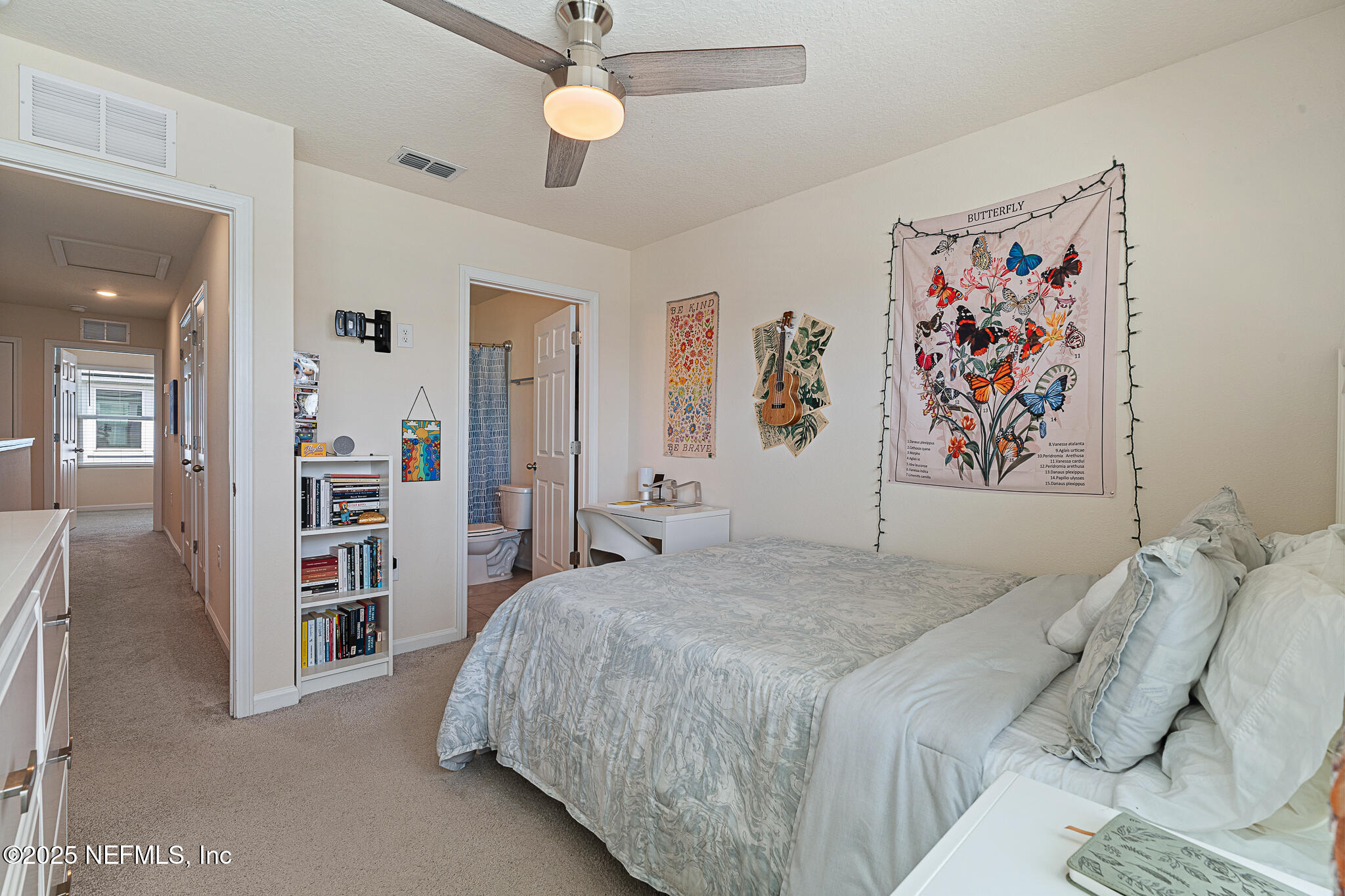 113 Red House Cir Street St. Augustine, FL 32084 - Photo 18 of 40 a bedroom with a bed and a book shelf