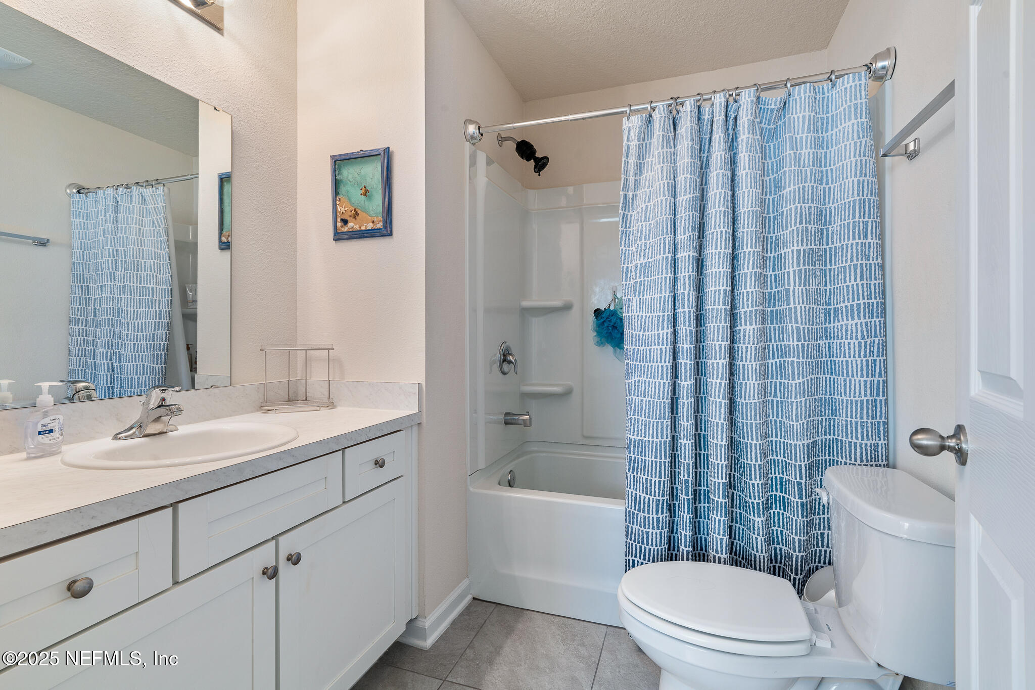 113 Red House Cir Street St. Augustine, FL 32084 - Photo 19 of 40 a bathroom with a sink a toilet a mirror a vanity and shower