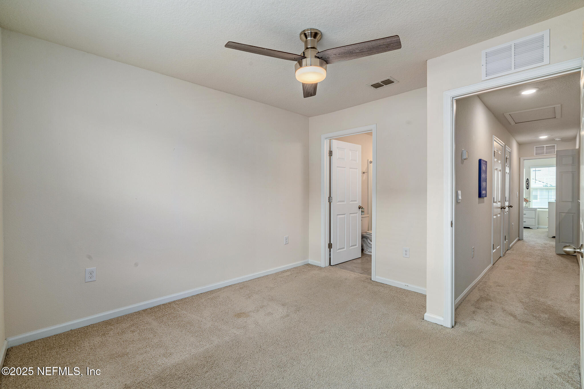 113 Red House Cir Street St. Augustine, FL 32084 - Photo 23 of 40 an empty room with fan and a ceiling fan