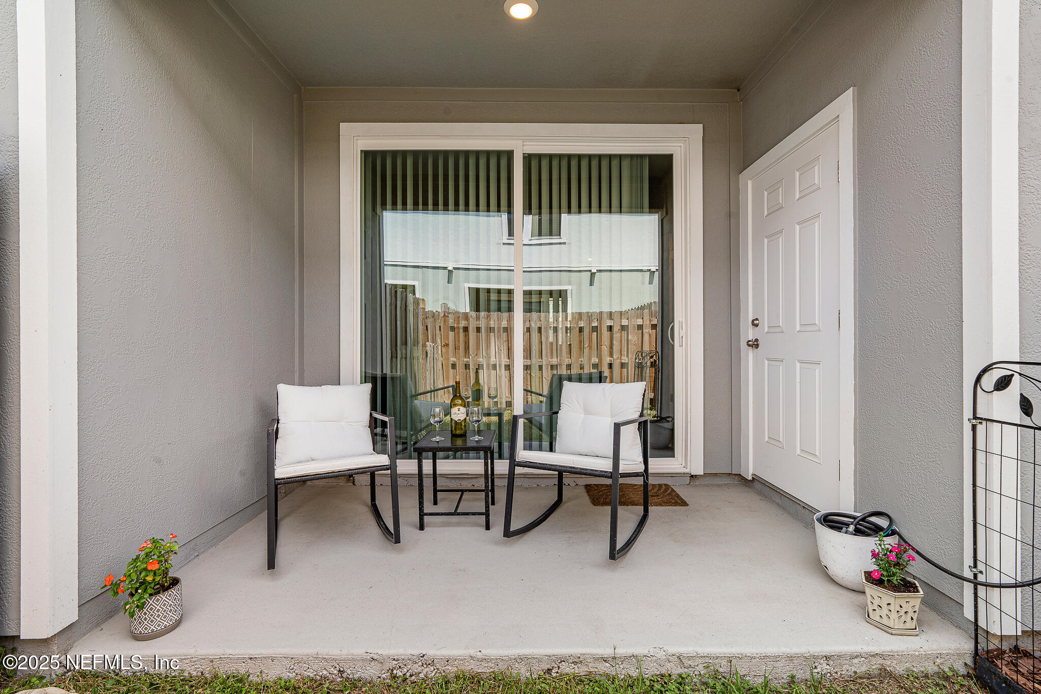 113 Red House Cir Street St. Augustine, FL 32084 - Photo 26 of 40 a living room with furniture a flat screen tv and a table