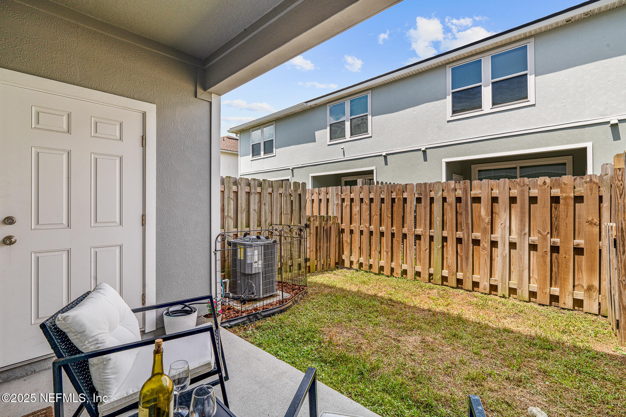 113 Red House Cir Street St. Augustine, FL 32084 - Photo 27 of 40 a view of a chair and table in the room