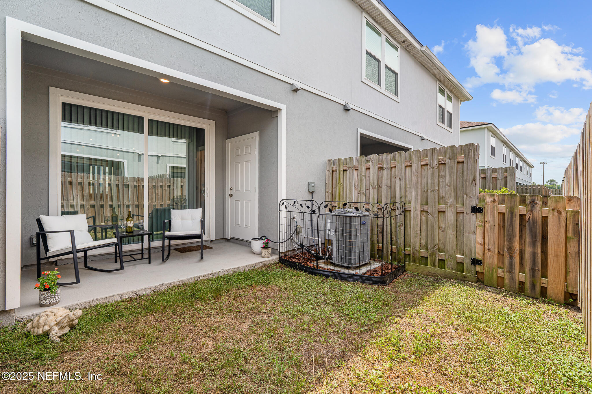113 Red House Cir Street St. Augustine, FL 32084 - Photo 29 of 40 a view of a backyard with a patio