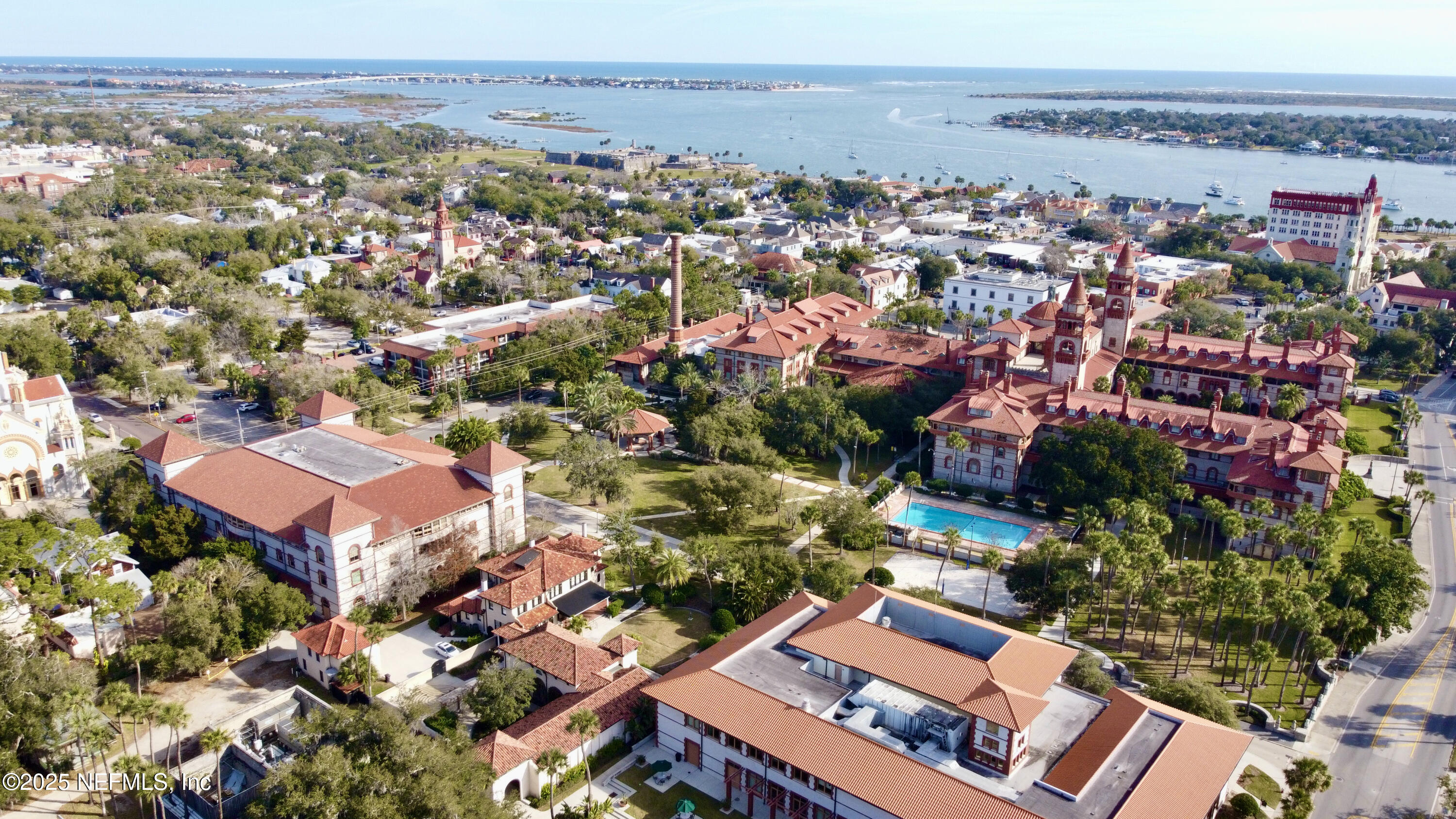 113 Red House Cir Street St. Augustine, FL 32084 - Photo 33 of 40 an aerial view of a city with lots of residential buildings and mountain view in back