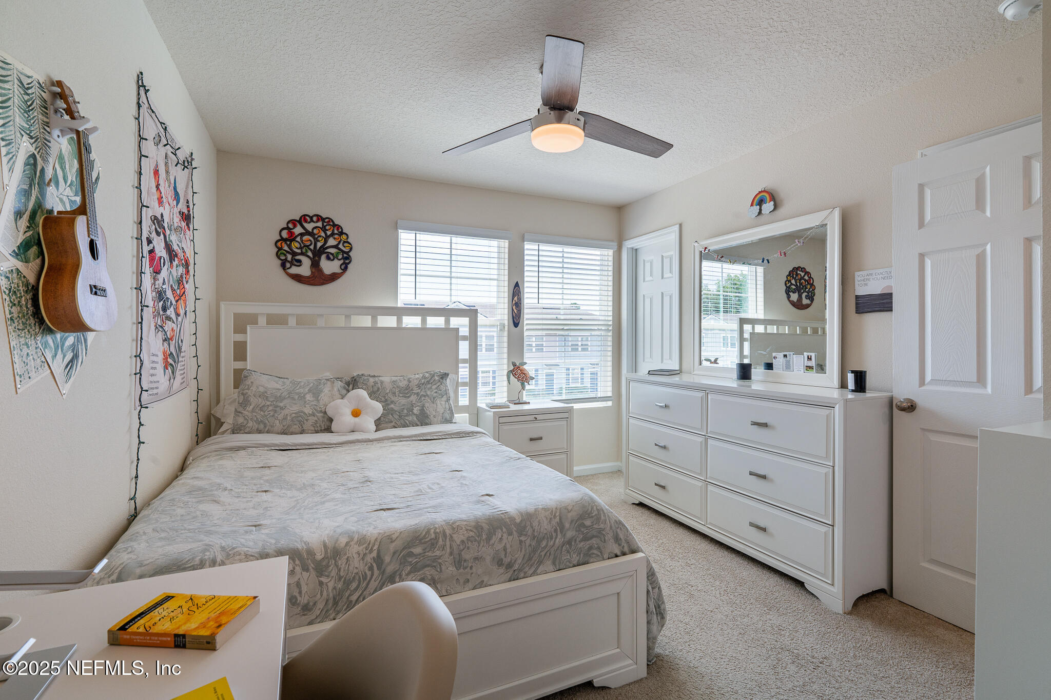 113 Red House Cir Street St. Augustine, FL 32084 - Photo 5 of 40 a bedroom with a bed and a chandelier