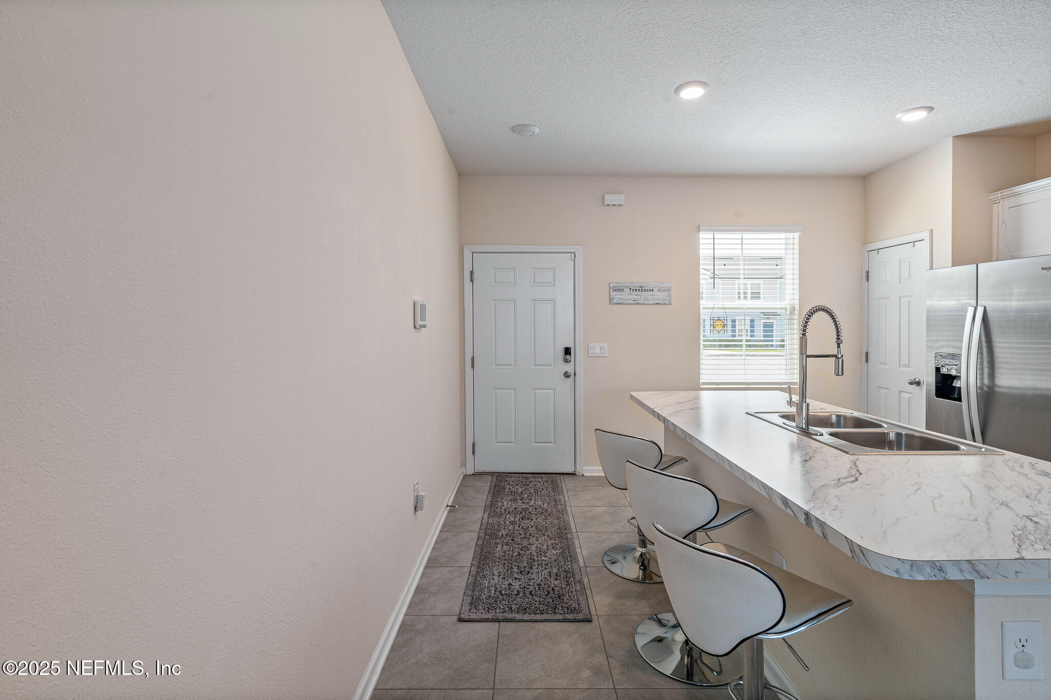 113 Red House Cir Street St. Augustine, FL 32084 - Photo 6 of 40 a kitchen with stainless steel appliances granite countertop a sink and a refrigerator
