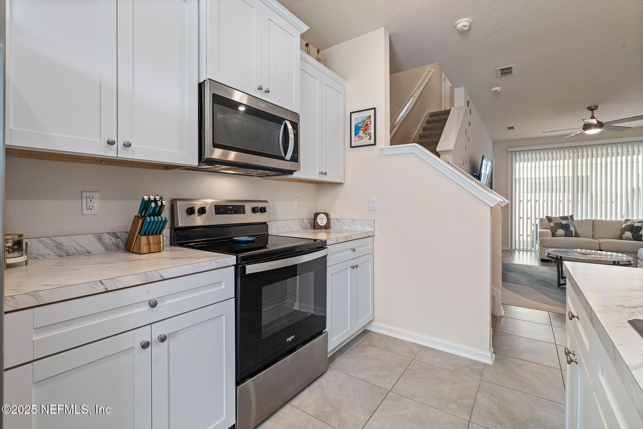 113 Red House Cir Street St. Augustine, FL 32084 - Photo 8 of 40 a kitchen with stainless steel appliances granite countertop a sink a stove a microwave and a refrigerator