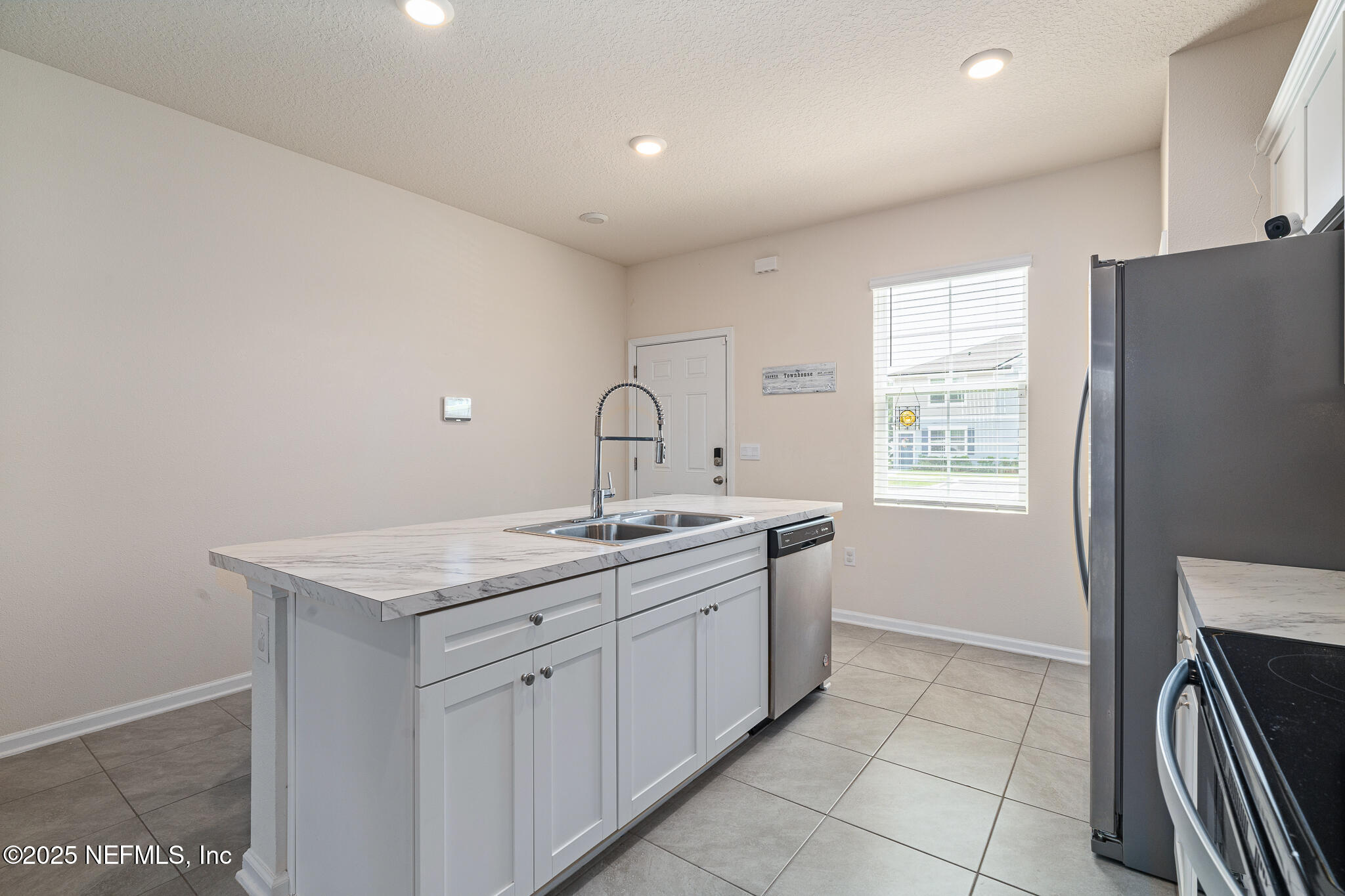 113 Red House Cir Street St. Augustine, FL 32084 - Photo 9 of 40 a kitchen with a sink dishwasher stove and refrigerator