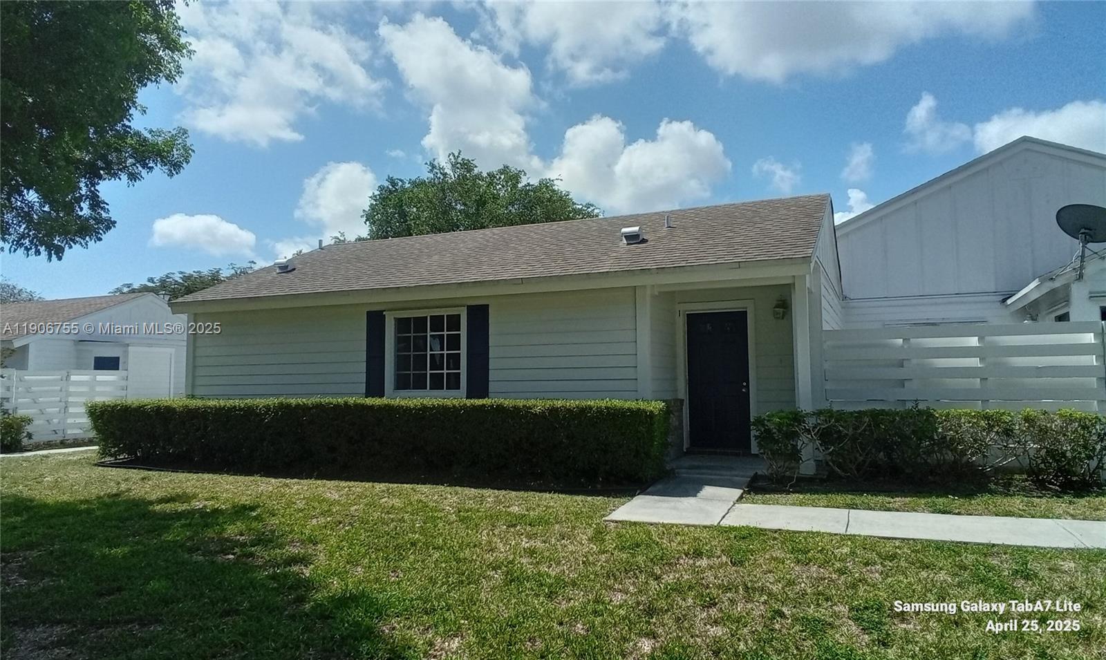 13764 Southwest 149th Cir Lane, Unit 1 Miami, FL 33186 - Photo 2 of 16 a view of a house with a yard