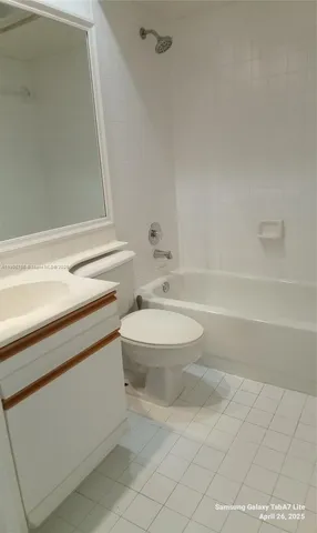 a bathroom with a toilet and a bathtub