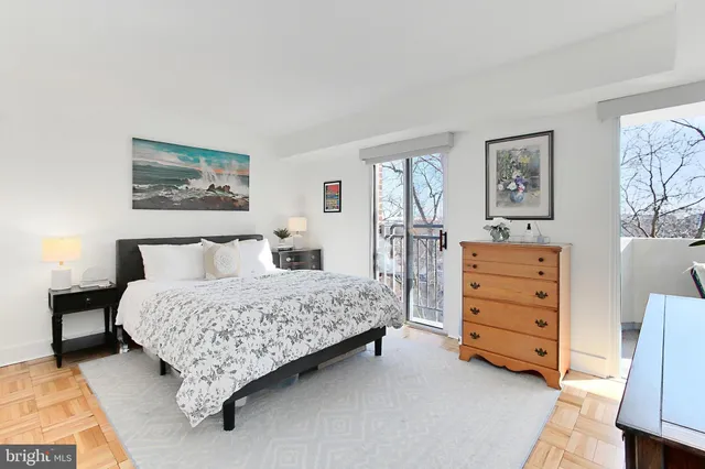 a bedroom with a bed and a cabinets