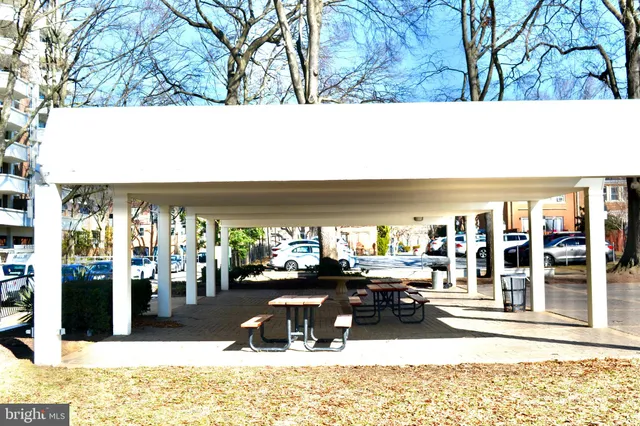 a view of a swimming pool with a sitting area
